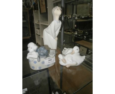 lladro figure and 2 nao figures