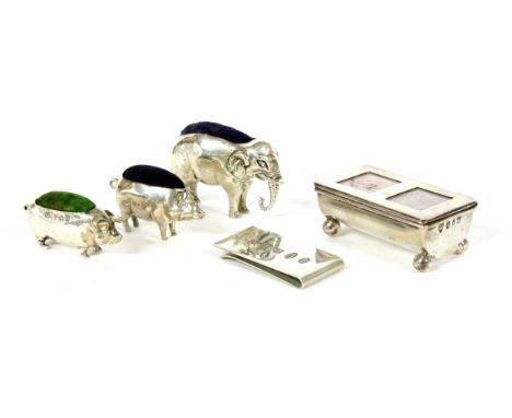 Silver items to include a double stamp box , by James Deakin and Sons, Birmingham 1898, three animal pin cushions, an elephan