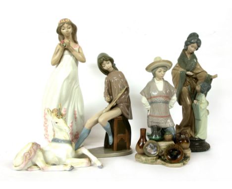 A quantity of ceramic figures, to include Lladro and Nao, etc. comprising unicorns, an Inuit girl, etc.