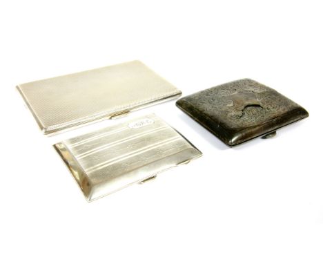 A silver cigarette case , with engine turned decoration and two other sterling silver cigarette cases, including a Chester ex