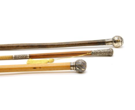 Two silver topped riding crops and a swagger stick , to include a Swaines and Adeney example, and the swagger stick with the 