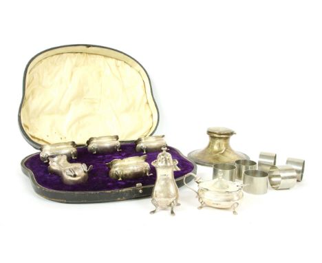 A cased Walker &amp; Hall seven piece cruet set, with associated mustard spoon, Sheffield, 1909, a capstan inkwell by S Blanc