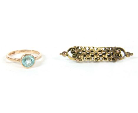 A 9ct rose gold single stone zircon ring, 2.46g, and a gold curb link brooch, with bead and scroll detail, 2.89g