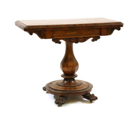 An early Victorian rosewood fold over top card table, on an octagonal baluster stem and platform base, 92cm wide, 46cm deep, 