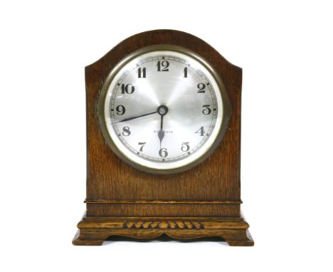 An oak cased electric mantel clock by Bulle , 21.5cm high