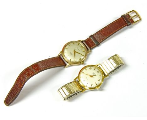 A 9ct gold Mappin &amp; Webb automatic strap watch, silver dial with Arabic and triangular pointers, presentation description