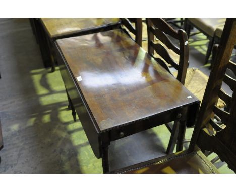 A 19th Century mahogany Pembroke table with a single frieze drawer raised on ring turned legs.