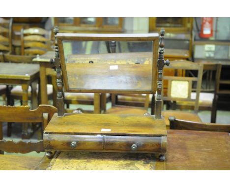 A 19th Century mahogany toilet mirror with ring turned supports and two bow front frieze drawers.