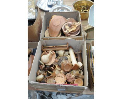 A large quantity of turned wood items comprising various bowls, egg cups, vases, lidded pots, penknives, compass, razors, clo