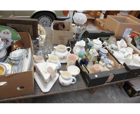 A large quantity of ceramics and glass to include examples by Poole and Midwinter, together with various glass vases, candles