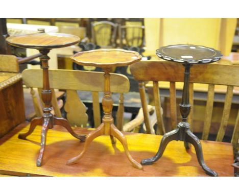 A Mahogany wine table on a ring turned and lobed shaft and 2 other wine tables. (3)