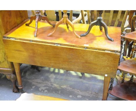 An Early 19th century mahogany Pembroke table on ring turned tapering legs.
