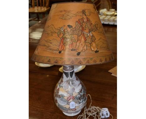 A Japanese Satsuma vase converted to a lamp, with a decorative parchment shade