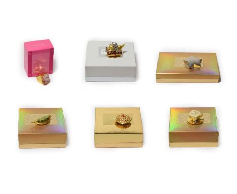 Six assorted Estée Lauder solid perfume compacts, comprising 'Shining Star'; 'Beautiful Café'; 'Playful Kittens'; 'Beautiful 