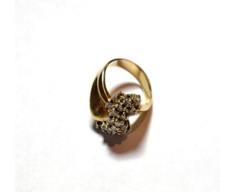 A diamond cluster ring, asymmetric form, set with twenty round brilliant cut diamonds, total estimated diamond weight 1.00 ca