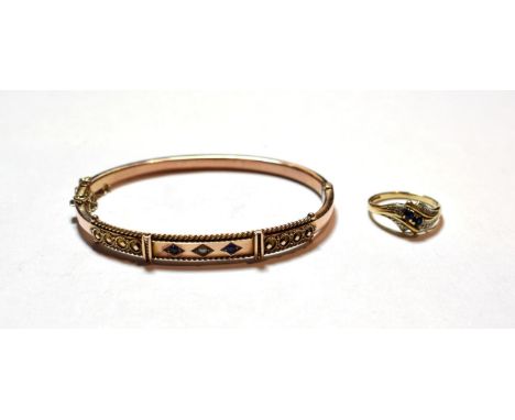 A 9 carat gold sapphire and split pearl bangle; and a 9 carat gold sapphire and diamond dress ring, finger size K1/2.  Gross 