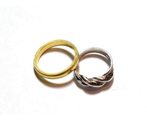 A 9 carat white gold twist ring, finger size L; and an 18 carat gold band ring, finger size Q.  9 carat gold ring - 4.1 grams