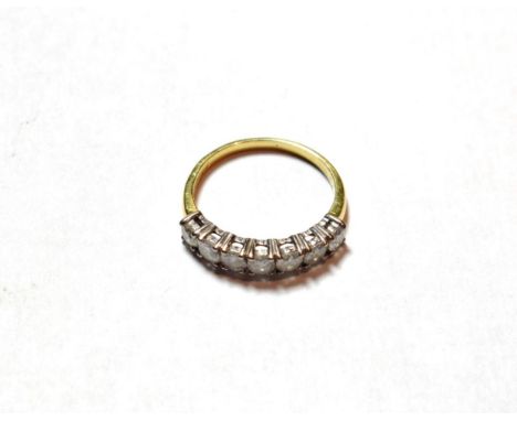 A diamond seven stone ring, finger size M