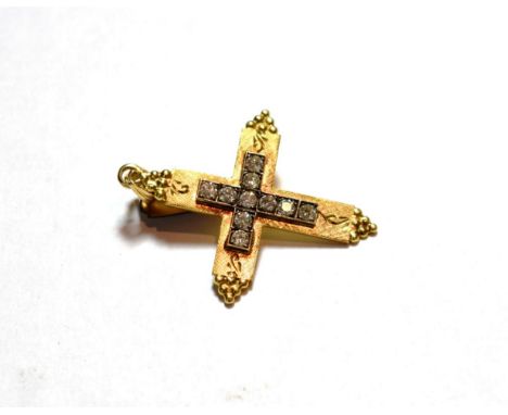 A diamond cross pendant, the cross motif set throughout with round brilliant cut diamonds in white claw and channel settings,