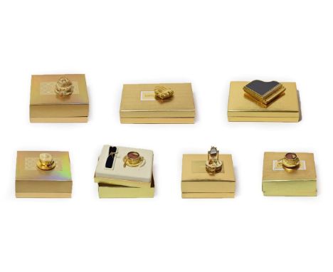 Five assorted Estée Lauder solid perfume compacts, comprising 'Beautiful Party Cake', 'Tea Cup', 'Beautiful Café', 'Heart to 