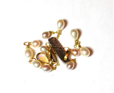 Eleven cultured pearl charms/pendants, unmarked; together with a 9 carat gold opal pendant, length 2.4cm; an opal pendant, un