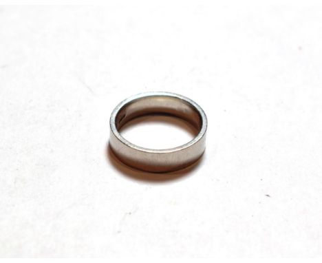 A platinum band ring, finger size L.  Gross weight 8.1 grams 
