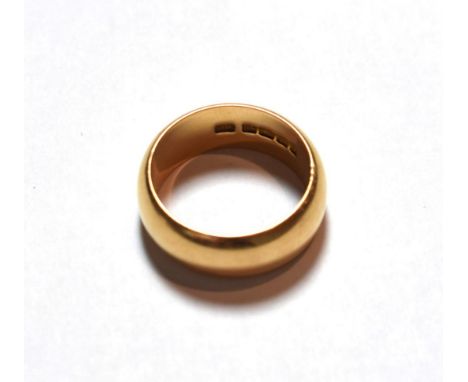 An 18 carat gold band ring, finger size V.  The ring is hallmarked with sponsor's mark 'SH', Birmingham, 1905. Gross weight 1