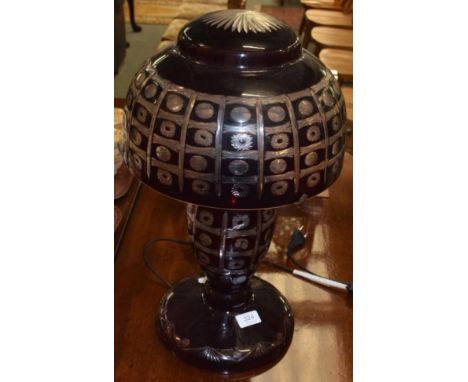 A large cut glass cranberry table lamp