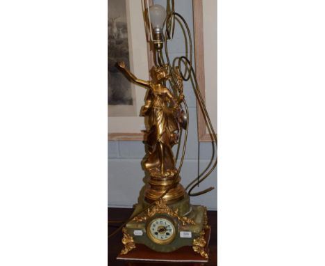 A early 20th century green onyx figural striking clock/lamp, now converted into a electric lamp 