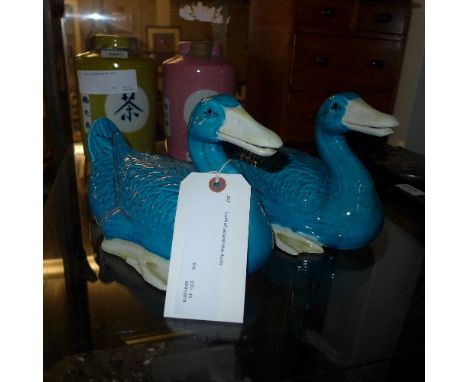 A pair of ceramic blue ducks