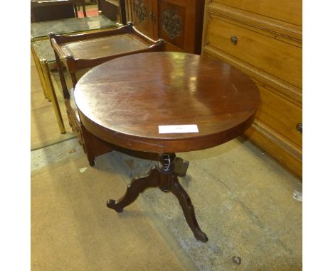 A C19th mahogany occasional table the circular top raised on tripod supports