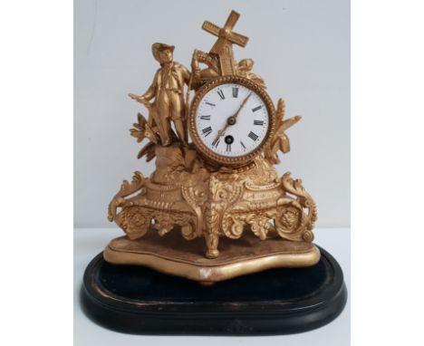 FRENCH GILT METAL MANTLE CLOCKthe circular enamel dial with Roman numerals and a 30 hour movement, surmounted with a windmill