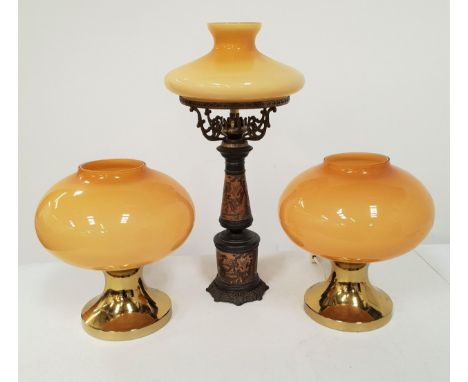 PAIR OF 1970s TABLE LAMPSwith brass shaped bases and yellow glass shades, 28cm high, together with an oil lamp style lamp wit