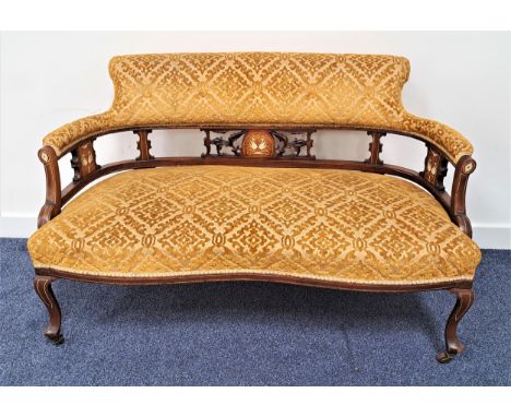 EDWARDIAN MAHOGANY PARLOUR SOFAwith a shaped padded button back above carved columns inlaid with griffin motifs, above a stuf