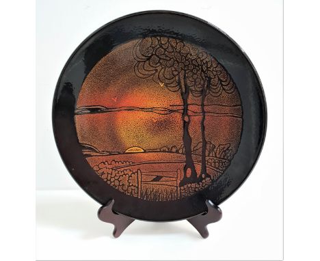 POOLE POTTERY AGEAN CHARGERwith a dark brown border encasing a sunset over fields, 35cm diameter 