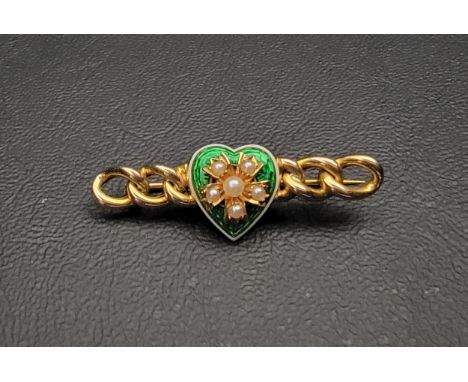 ENAMEL AND SEED PEARL SET GOLD BROOCHthe green enamel heart decorated with seed pearl set flower and flanked by chain link st