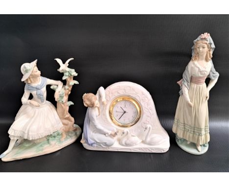 LLADRO PORCELAIN FIGURINELady Goya 5125, 31.5cm high, Lladro swan clock with a quartz movement 5777, 18.5cm high and a Nao fi