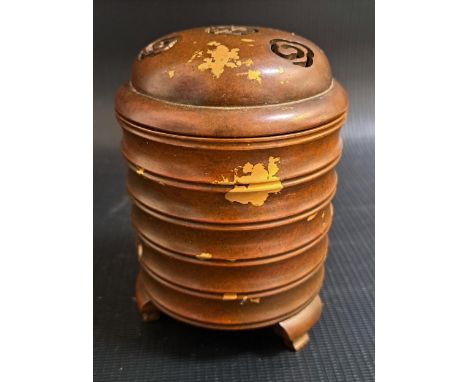 CHINESE BRONZE INCENSE BURNERof ribbed cylindrical form on three stout shaped supports, with a domed pierced lid, 11.5cm high