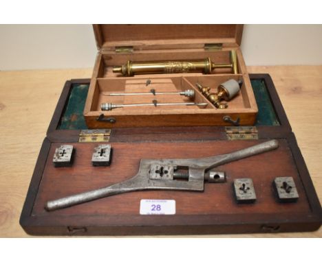 A 19th century Joseph Grey &amp; Son medical brass syringe in fitted case with parts, L16cm, sold together with a vintage tap