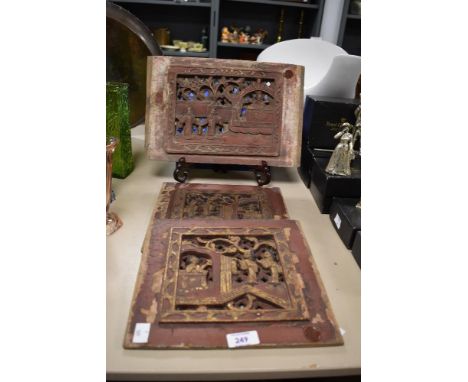 Three vintage hand carved lacquered gilt wood panels depicting biblical scenes, two measuring 25cm x 25cm and the other 34cm 