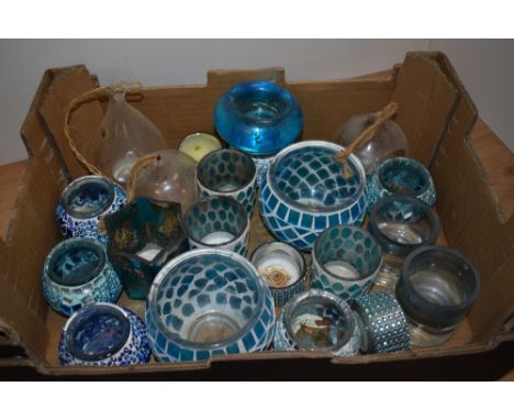 A mixed assortment of vintage tea light holders.