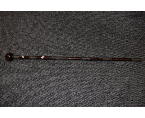 A South African Zulu tribal wire bound knobkerrie, of traditional form with six bands of bound wire decoration 99cm