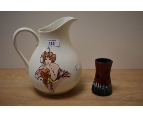 A Poole Fleurie pattern pottery pitcher, decorated with an image of a woman in the Art Nouveau style, h22cm, sold together wi