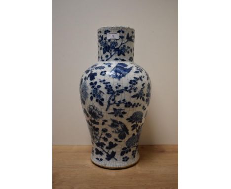 An early 20th century Chinese blue and white vase of baluster form, decorated having pomegranates, lotus flowers and foliage 