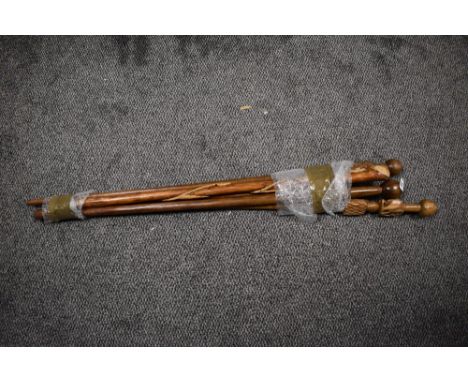 A hard wood walking stick decorated with carved Africa figure, h103cm, sold together with various other walking sticks, ( 5 )