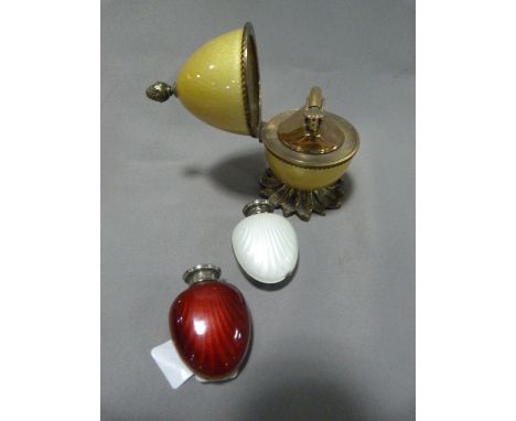 Enameled Egg Table Lighter "Evans USA" and Two Danish Silver Enameled Scent Bottles 
