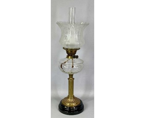 19TH CENTURY OIL LAMP, black ceramic base, reeded brass column, circular cut glass reservoir, twin burners and etched fluted 