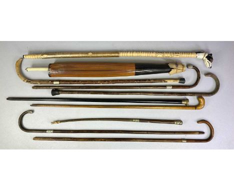 COLLECTION OF VINTAGE WALKING STICKS & RELATED ITEMS, some with silver mounts, Chinese paper parasol etc. Provenance: private