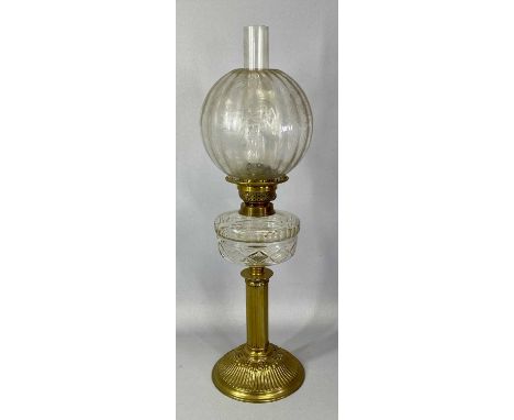 LATE 19TH CENTURY OIL LAMP, circular brass base and reeded column, clear cut glass reservoir, twin burner and etched globular