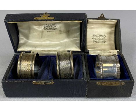 CASED PAIR OF SILVER NAPKIN RINGS engine turned decoration, George Unite and a cased single silver napkin ring with gadrooned